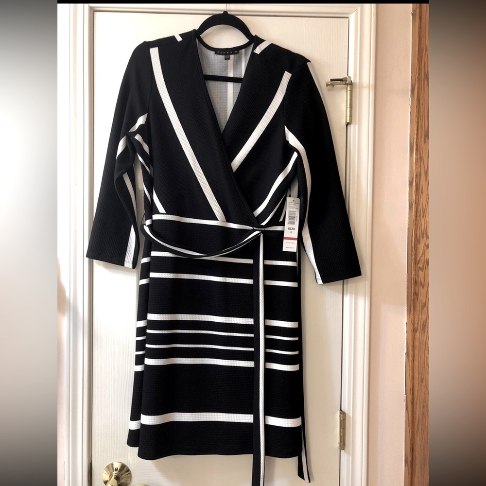 Beautiful slimming knee length dress.  Never worn.